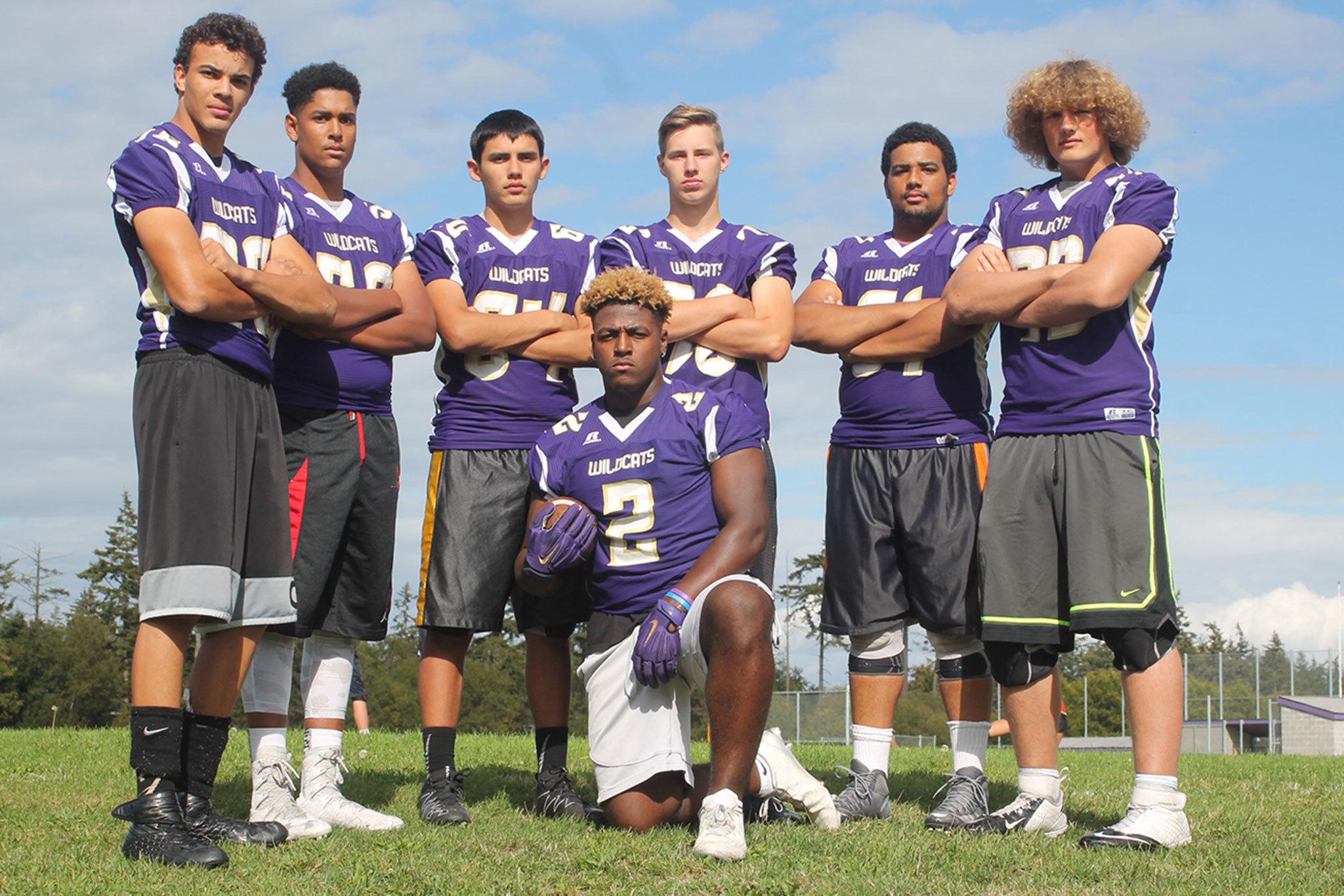 Princeton Lollar, front, is surrounded by the linemen who helped him set a new Oak Harbor High School career rushing record. From the left are Ozell Malcolm Jackson IV, Kamren Mebane, Weston Whitefoot, Colton Burdick, D’Andre Bellamy and Sam Zook.