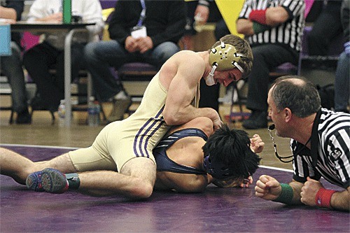 Cody Fakkema takes control in his subregional title match with Glacier Peak's John Kim.