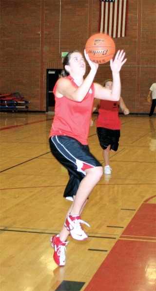 Linde Maertens shows good form shooting a lay up during practice.