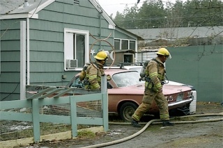 Firefighters from the Oak Harbor Fire Department doused a  blaze that damaged a home Monday morning on Goldie Street.