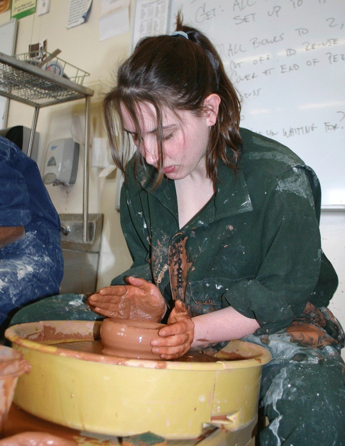 Rachel Hardin works quickly to create yet another bowl for the Empty Bowls Fundraiser to benefit the Help House.