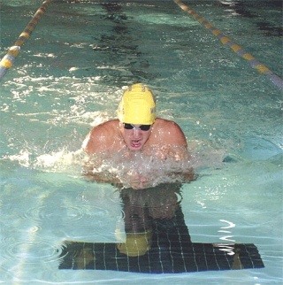 Oak Harbor’s Yale Rosen approaches the wall and prepares to turn for home on the final leg of the 100 breaststroke. Rosen won the event in a time of 1:15.59.