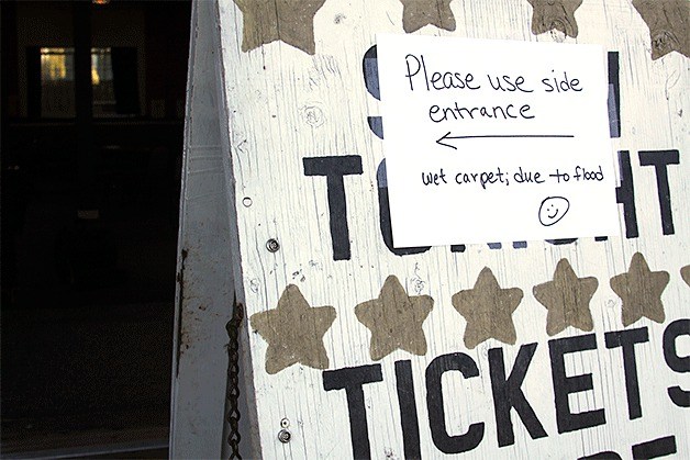 A sign points visitors to an alternate entrance to the Whidbey Playhouse Wednesday