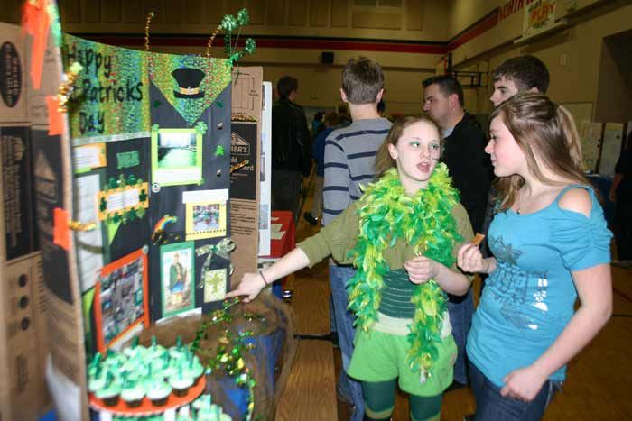 Laurel Warden presents her Cultural Fair project about the history of Saint Patrick’s Day to Karleigh Lamar Wednesday.