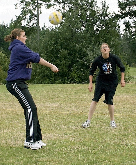 Jessica Muzzall bumps the ball while sister