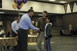 Principal Dwight Lundstrom and Assistant Superintendent Lance Gibbon shake the students’ hands as they dole out awards.