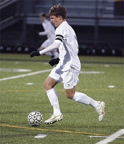 Oak Harbor's Alex Krantz advances the ball against Marysville Getchell.