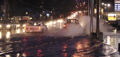 Flooding along Highway 20 slowed rush-hour traffic Monday evening. City officials hope to fix the problem this summer.