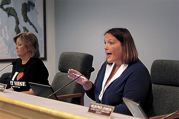 Island County Commissioner Jill Johnson scolds audience members for outbursts during discussions about jet noise.