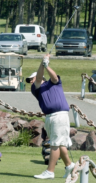 Oak Harbor senior Phil Reedy unleashes his driver to start the second round of the 4A District 1 golf tournament Thursday morning at the Gallery Golf Course. Reedy will be making his fourth trip to the state tournament with a 36-hole total of 152 strokes.