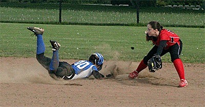 Coupeville shortstop McKayla Bailey takes a throw from second baseman Jae LeVine after a pop-out to double off a Chimacum runner.