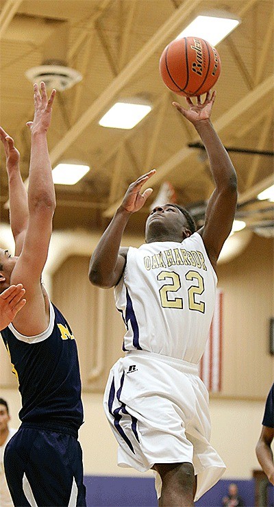 Savion Hollins-Passmore flips in a left-handed shot in the loss to Mariner Monday.