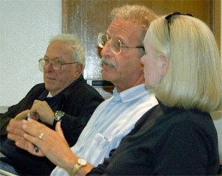 Oak Harbor resident Marshall Goldberg questions Sno-Isle Library officials about the system’s budget deficit and staff salaries during a public meeting Thursday night at the Oak Harbor Public Library.