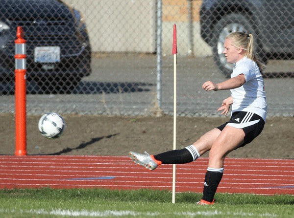 Sage Reninnger launches a corner kick for Coupeville.