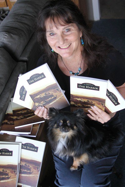 Peggy Darst Townsdin is all smiles after receiving a shipment of her new book