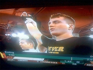 Oak Harbor graduate Tyler Elliot has his hand raised in victory after winning the 195-pound brigade boxing championship.