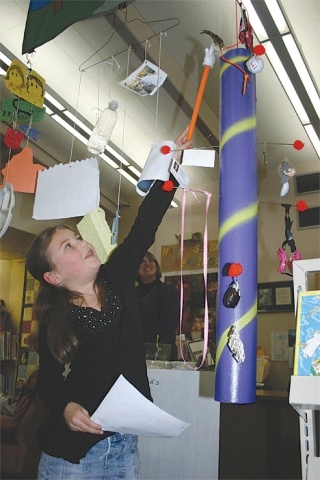 Coupeville Elementary School fourth-grader Bree Daigneault explains her “summer memory spinner” to Coupeville School Board members during Monday’s meeting. Each part of her spinner represented a different event that took place during the summer. She was one of a handful of fourth-graders to show off projects they completed in the early part of the school year.