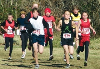 Twelve-year-old John Rodeheffer races ahead of the 250-person pack at Saturday’s meet.