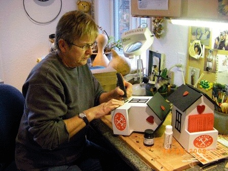 Joy Linde puts finishing touches on Central Whidbey Hearts & Hammers donation boxes.