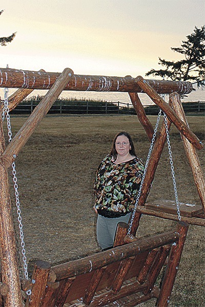 Isha Hendricks stands at a Whidbey park where she and her husband saw an unidentified flying object in the sky.