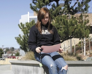 Skagit Valley College freshman McKenna Yockey stops for a break in the courtyard near the Old Main building