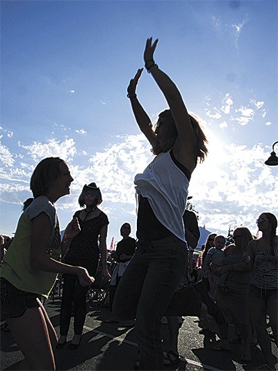 Music lovers dance to LeRoy Bell and His Only Friends during the Oak Harbor Music Festival Sunday