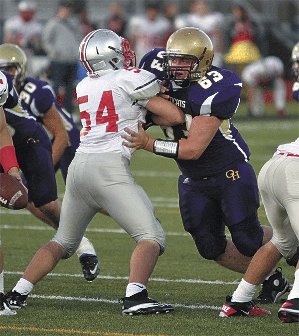 Oak Harbor's Jeremy Foster (63) fights through the block of Mountlake Terrace's Brett Potter. Foster led the Wildcats in tackles in Oak Harbor's big win.