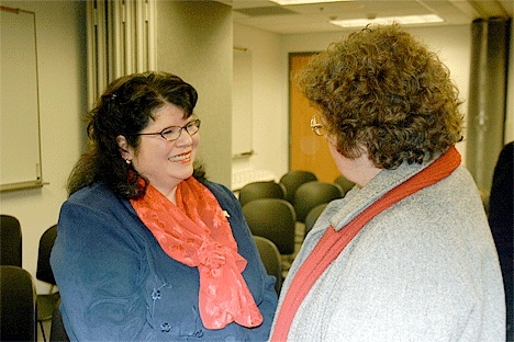 Patricia Terry speaks with Island County Clerk Sharon Franzen Wednesday night after the county commissioners appointed Terry to fill in as clerk once Franzen retires in a couple of weeks.