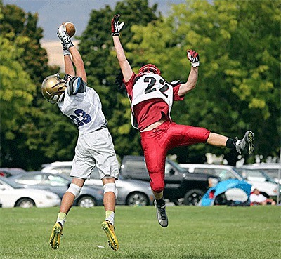 Kyle Nichols pulls down a pass from Jordan Bell over a Bellingham defender at team camp.