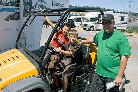 Mike Davis takes a break with his two boys