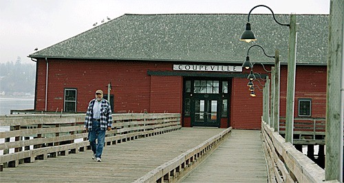 John Ballay from Coupeville strolls down the pier from the Wharf Tuesday morning. The historic Coupeville Wharf will be spruced up in 2013 as part of the Field School organized by the Trust Board of Ebey’s Landing.