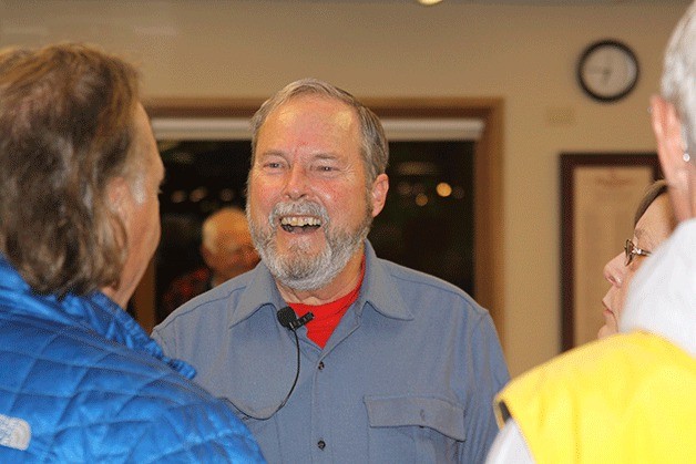 Lee James visits Ken Pickard and Kay Foss after his talk about the Pratt art collection at the Coupeville Library Dec. 7. An exhibit will be featured at the library this month.