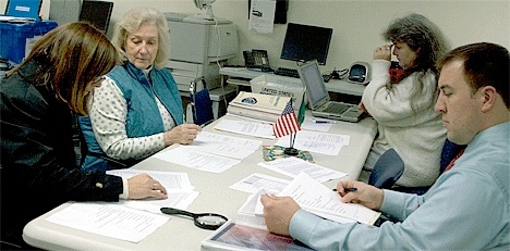 Canvassing Board members Island County Commissioner Helen Price Johnson (left)