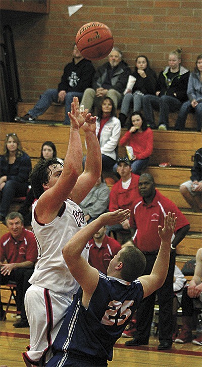 Coupeville's Nick Streubel scores over the defense of La Conner's Cameron Sherman Friday.