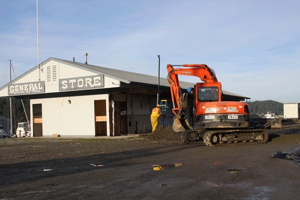 Photo by Ron Newberry/Whidbey News-Times Above: Workers prepped the site around the General Store at Deception Pass Marina last week as they got ready to move the store.