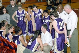 Oak Harbor coach Brett McLeod rallies his players and discusses some new strategy to counteract Kamiak’s changing defense during a timeout in the first half of Saturday’s Northwest District One 4A game at Marysville-Pilchuck.