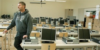 Pre-engineering teacher Ken Bender surveys the new computer-aided drafting room Thursday.