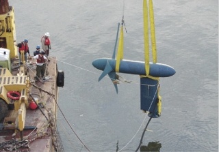 Workers install a Verdant Power Free Flow Turbine in the East River