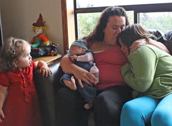 Coupeville resident Terra Villicana comforts her daughter