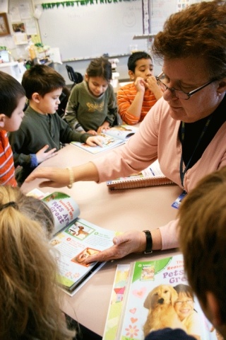 Special education teacher Heidi McDonald of Hillcrest Elementary School has her students read a passage in their Story Town books. The incoming stimulus funds will pay for an additional six to nine special education positions.