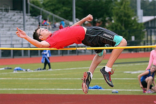 Corban Ferguson leaps to first place in the varsity high jump.