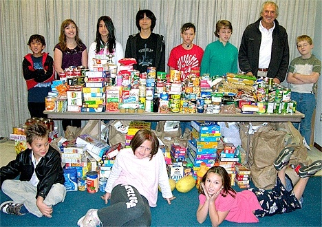 Whidbey Christian Elementary School students with the result of the 2008 “Share Not Scare” food drive. Pictured front the left are Patric Cauldwell