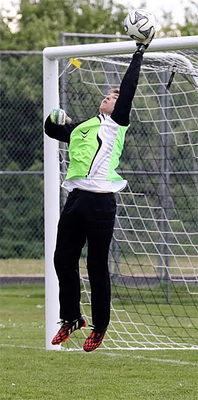 Coupeville goalkeeper Connor McCormick blocks a shot Monday.