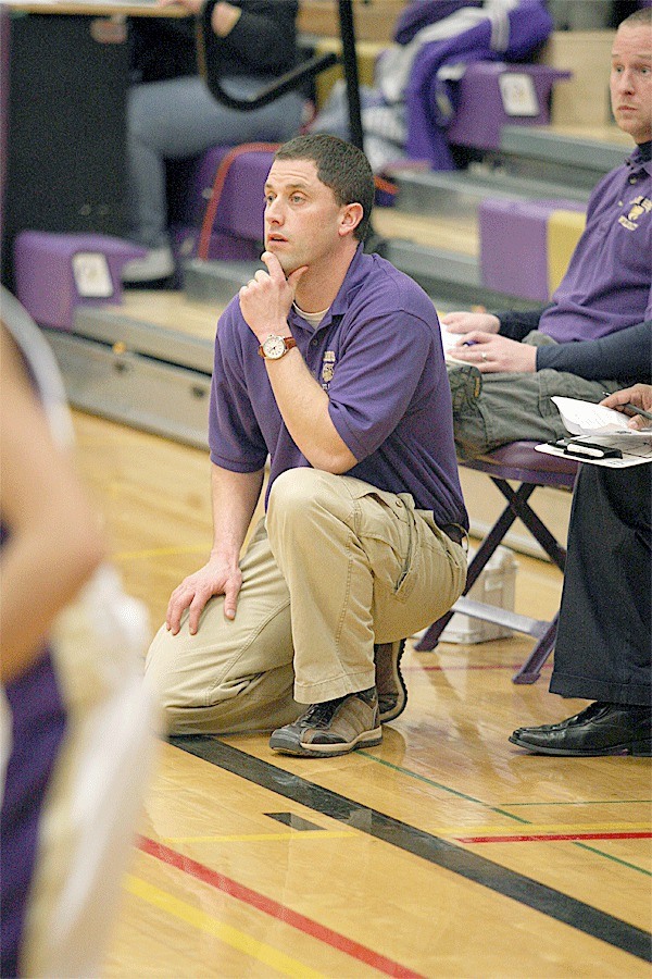 Brett McLeod watches on while the girls basketball team competes.