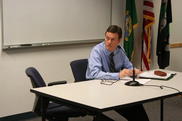 Island County Planning Director David Wechner listens to Island County commissioners at the Wednesday