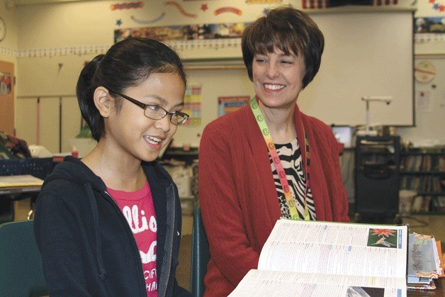 Trina Desquitado shares a story about the regional Spelling Bee with her fifth grade teacher Lynn Brown at Broad View Elementary.