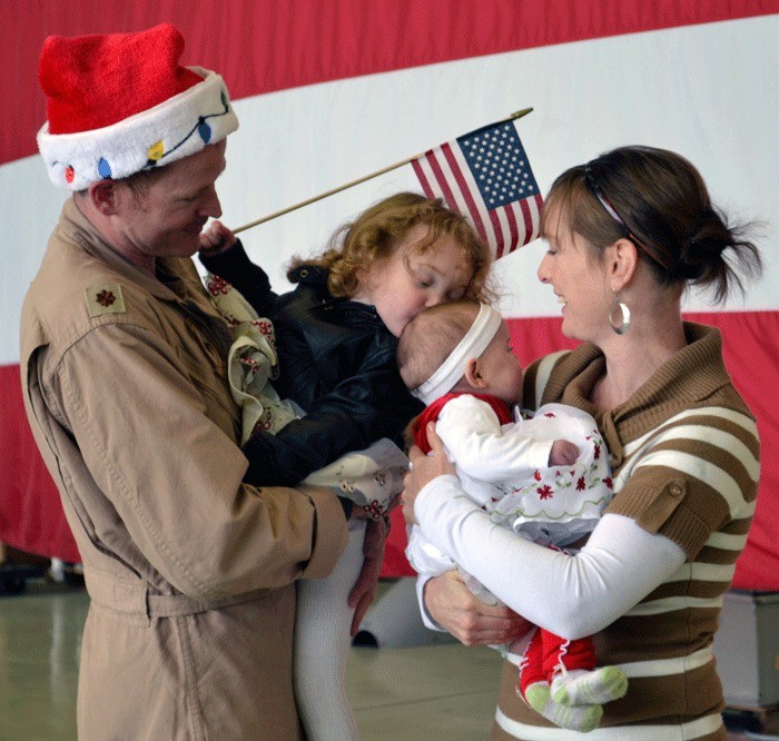 Lt. Cmdr. Tom Clarity holds his daughter