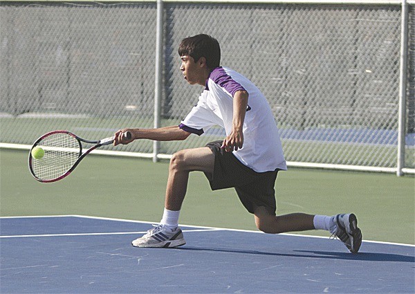 Harrison Miller returns a shot in his third singles win Thursday against Mountlake Terrace.