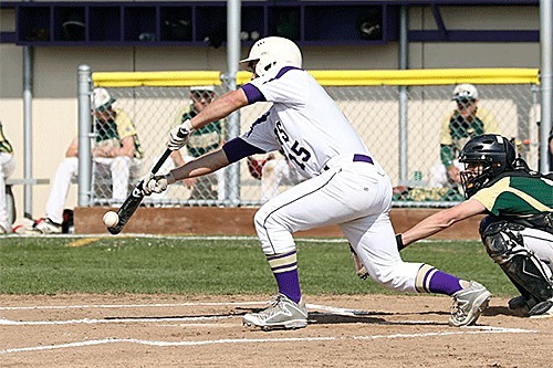 C.J. Meders drops down a bunt for Oak Harbor Monday.