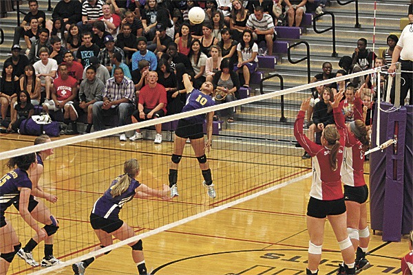 Janine DeGuzman (10) takes off for a spike against Stanwood.